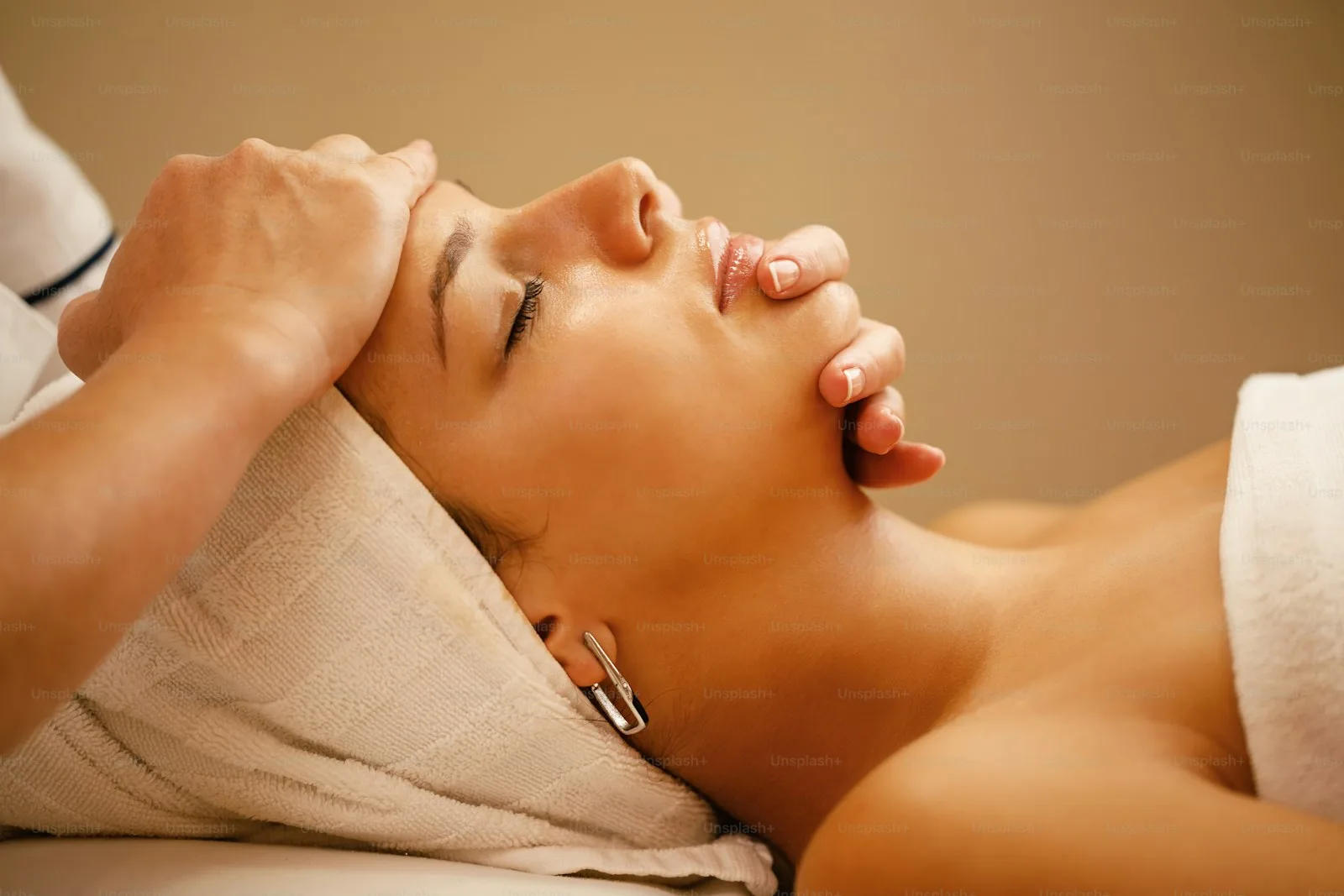 Woman receiving facial spa treatment at 416Skin Toronto